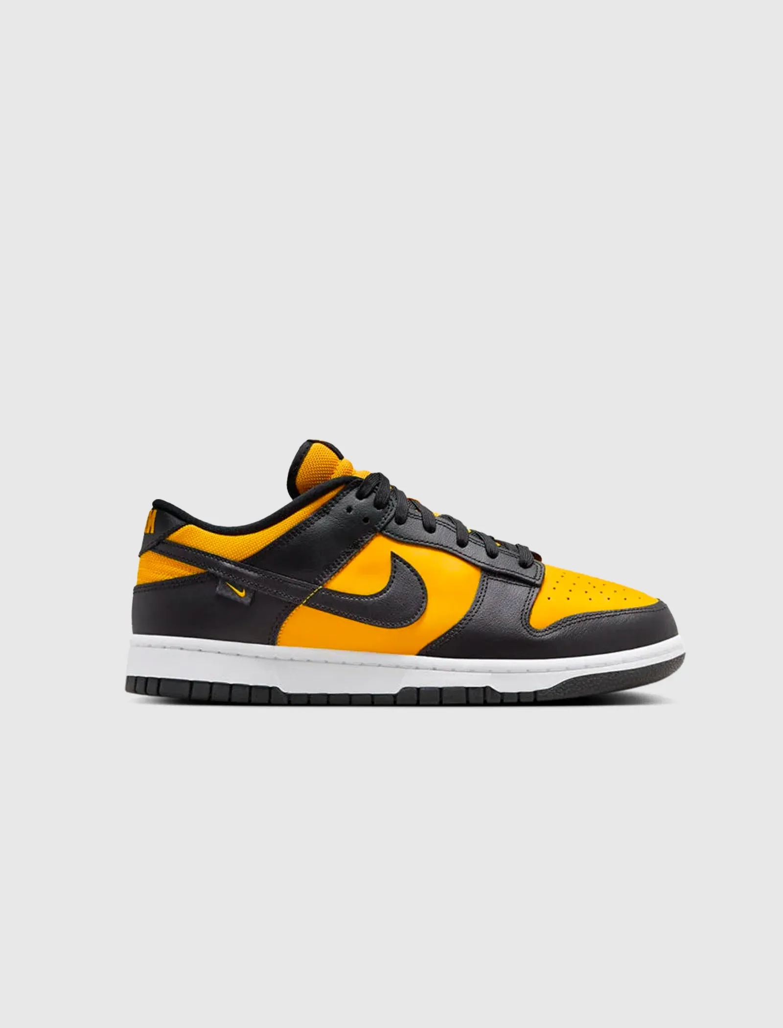 Dunk Low Black University Gold sneaker.