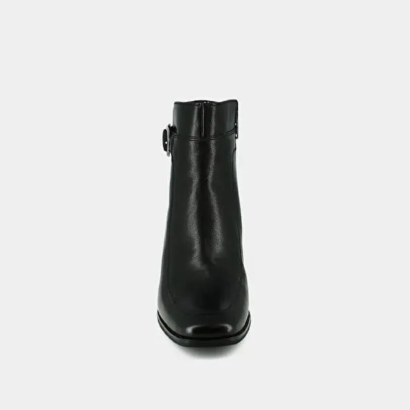 Heeled boots with buckles in black leather