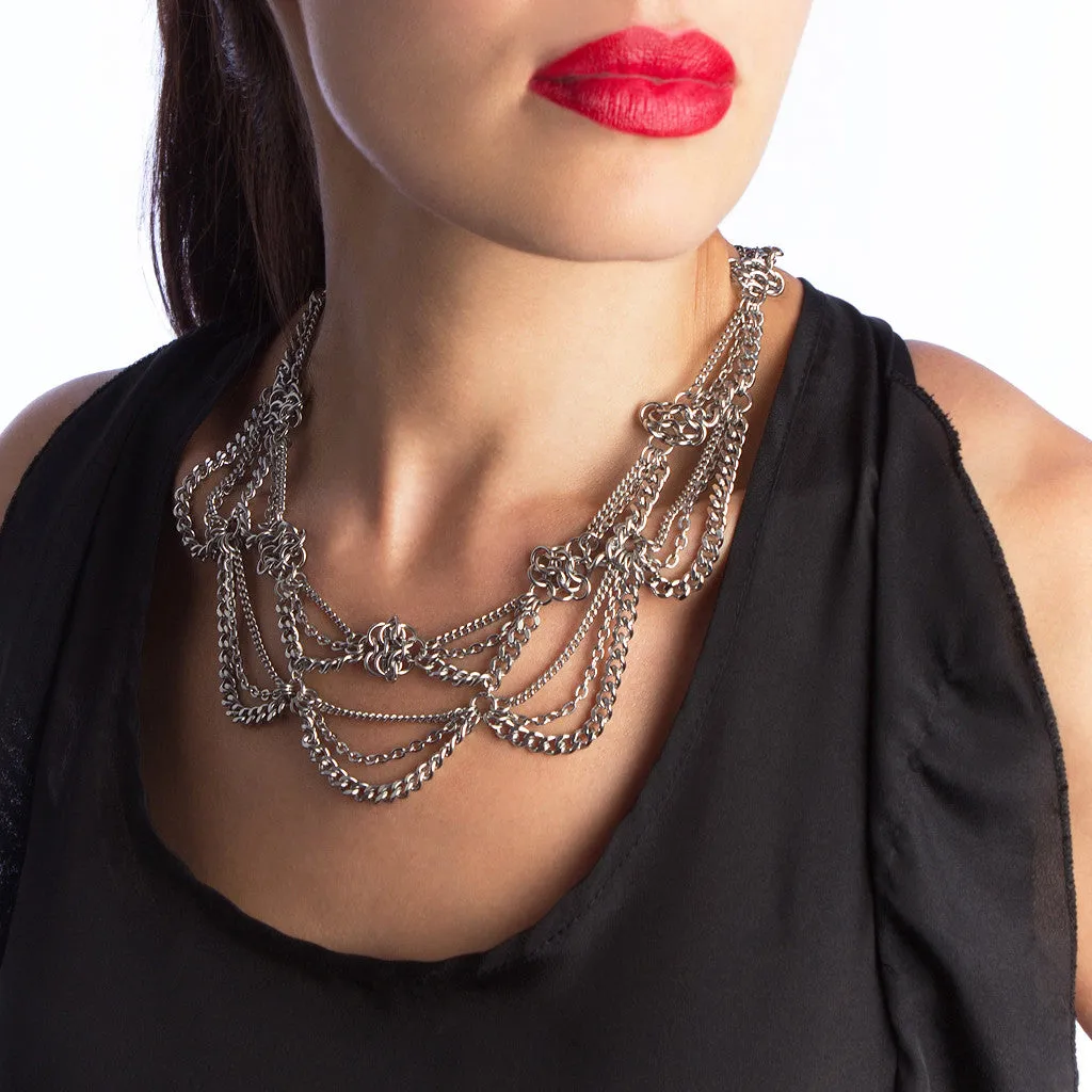 Metal 2-tier chain necklace with draping chains and rosettes