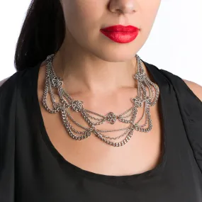 Metal 2-tier chain necklace with draping chains and rosettes