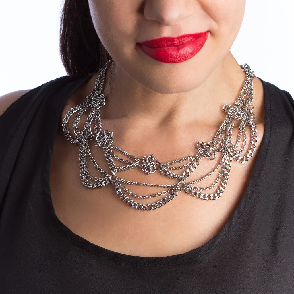 Metal 2-tier chain necklace with draping chains and rosettes