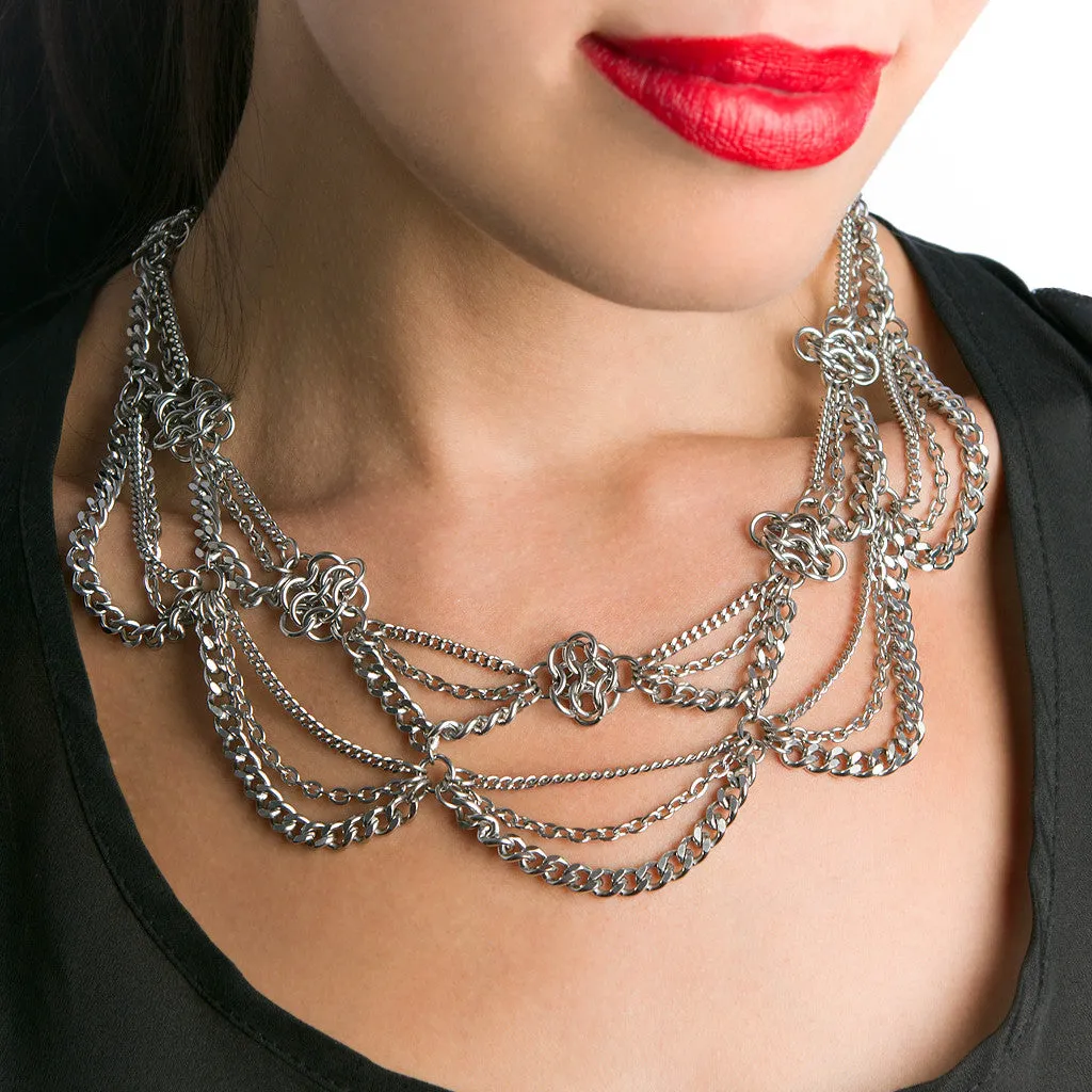 Metal 2-tier chain necklace with draping chains and rosettes