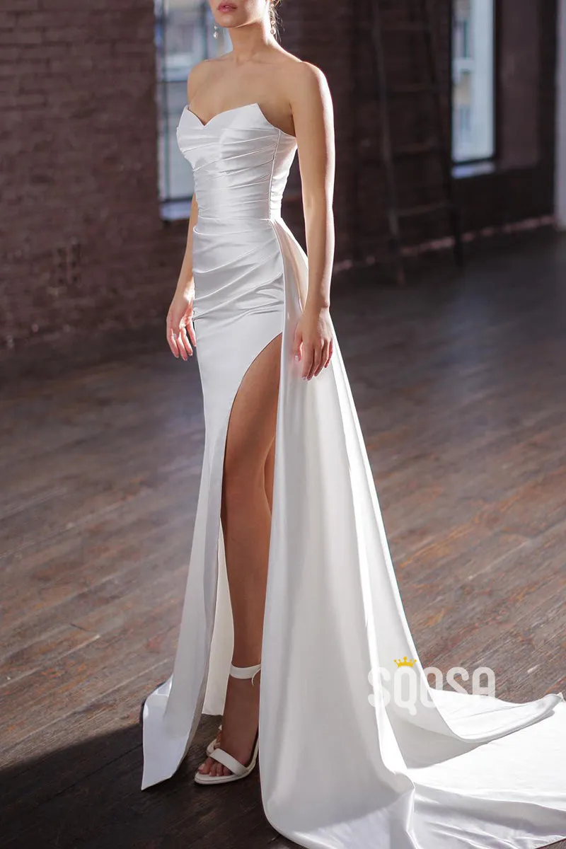 Satin strapless pleated wedding dress with side slit train.