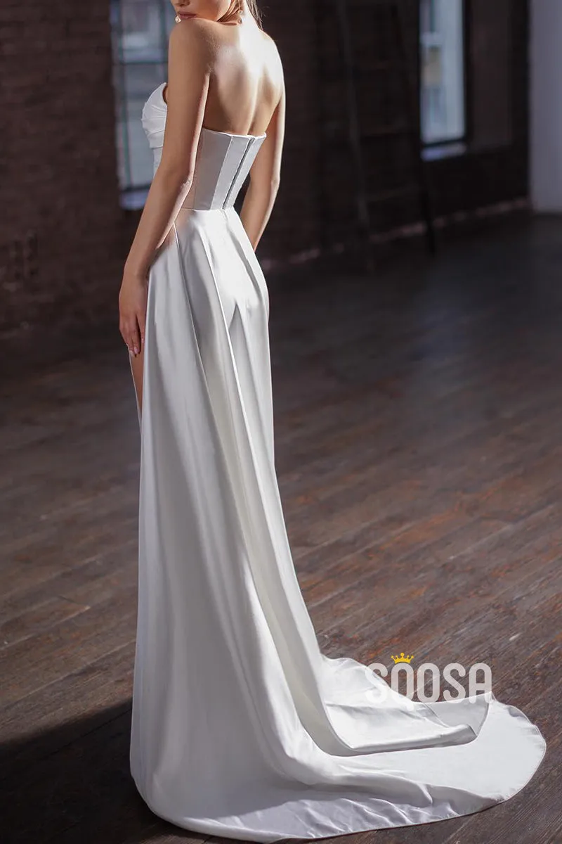 Satin strapless pleated wedding dress with side slit train.