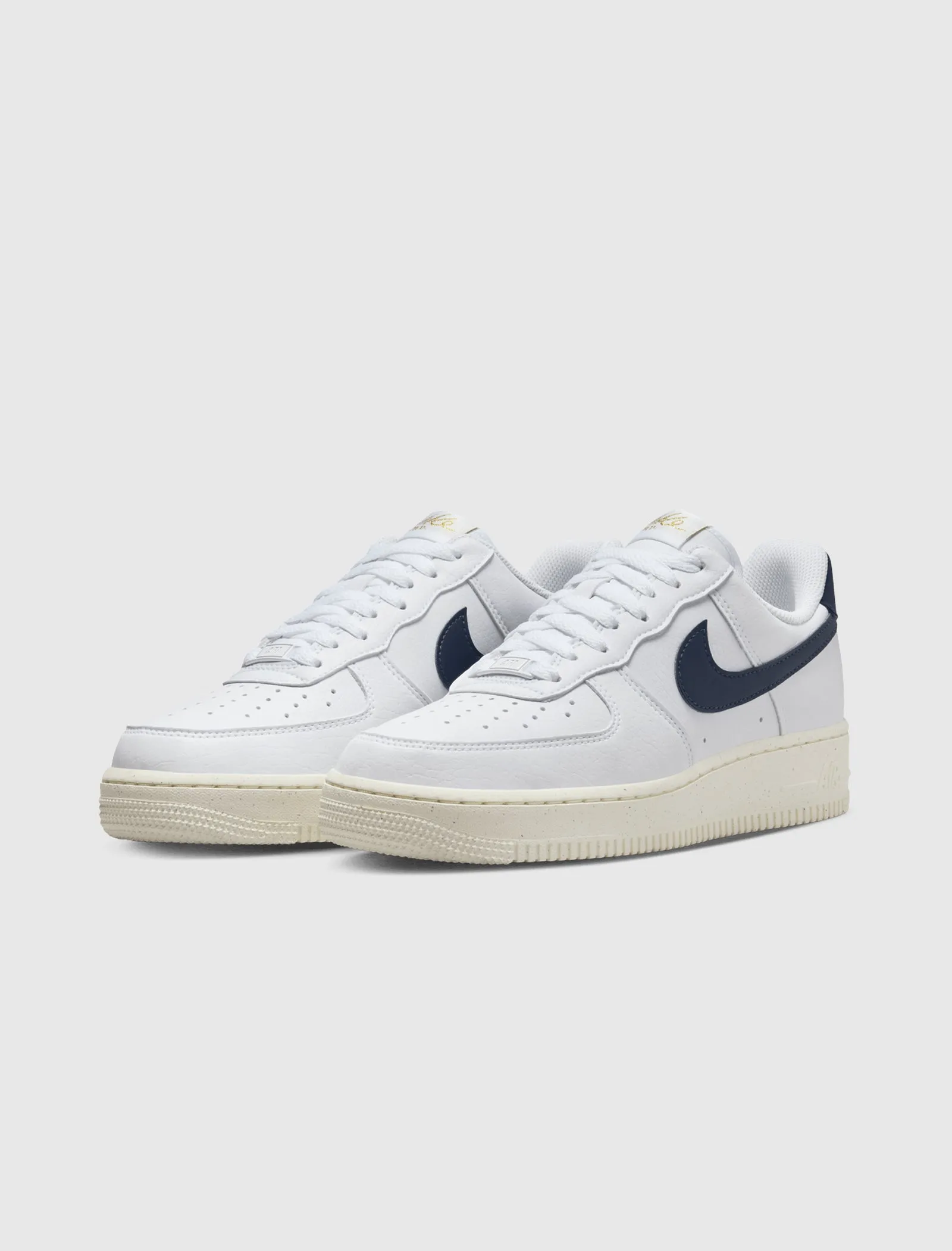 The result is: Nike Women's Air Force 1 '07 Next Nature White/Obsidian/Metallic Gold sneakers